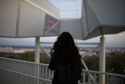 Rear view of woman standing at observation point