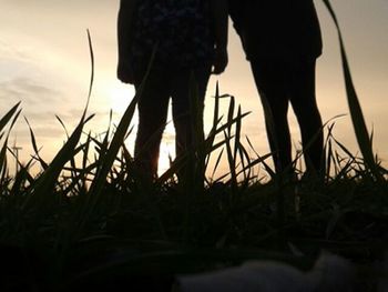 Silhouette of woman at sunset