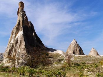 Rock formations on landscape against sky