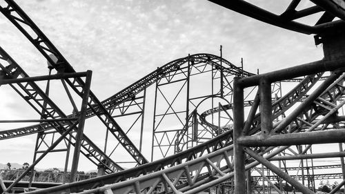 Low angle view of rollercoaster against sky