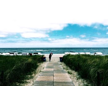 Scenic view of sea against cloudy sky