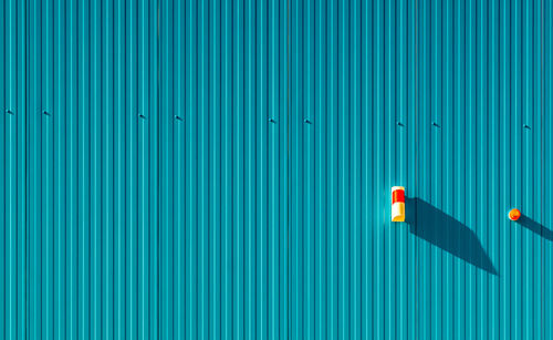 Alarm button against blue wall