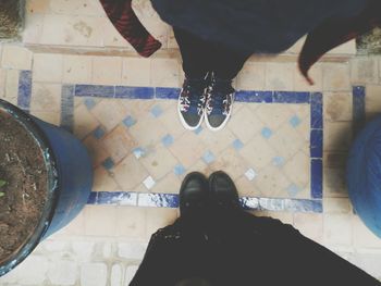 Low section of people standing on floor
