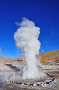 Geyser at el tatio against sky