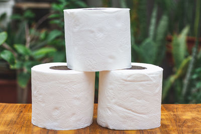 Close-up of white stack on table