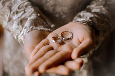 Close-up of couple holding hands