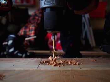 Close-up of hands working in factory