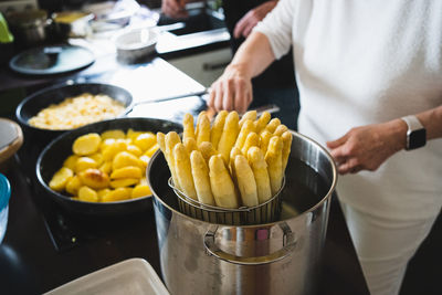 Midsection of man preparing food