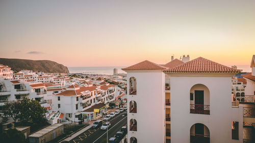 Houses in city at sunset