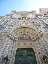 Low angle view of ornate building against sky