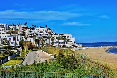 Scenic view of beach against blue sky