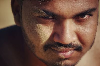 Close-up portrait of man with messy face