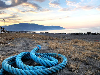 Close-up of rope tied on shore