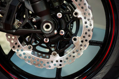 Close-up of machine part on motorbike tire