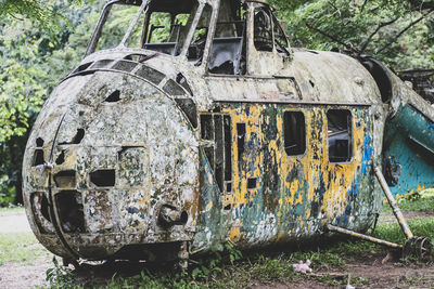 Old abandoned train on field