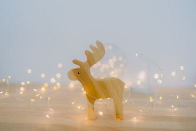 View of deer on illuminated wall against sky