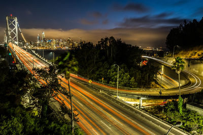 High angle view of light trails on road in city