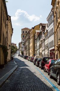 Road amidst buildings in city