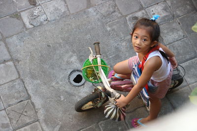 A little girl riding her bicycle