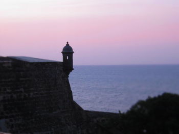 Scenic view of sea against sky at sunset