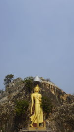 Statue of buddha against clear sky