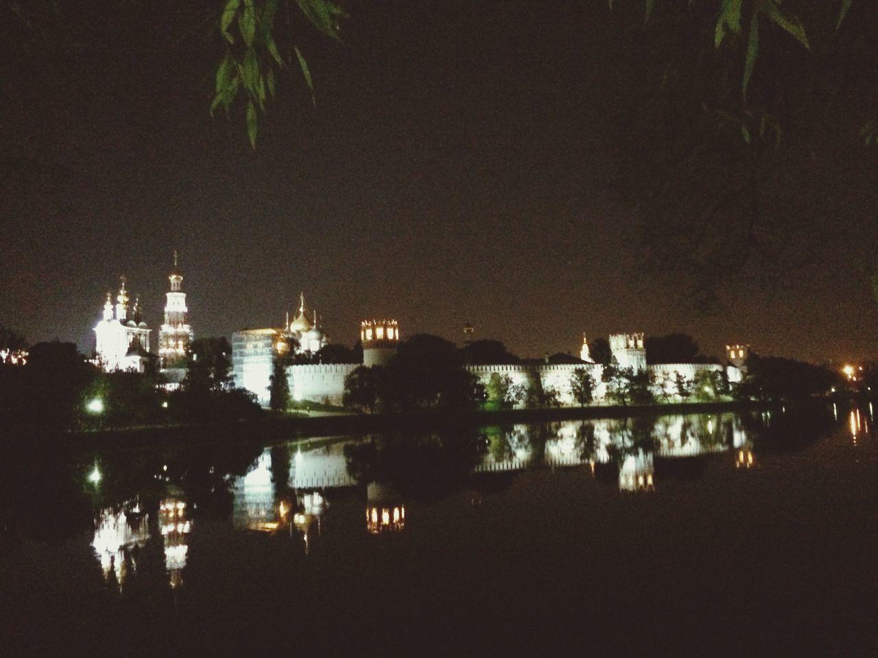 night, illuminated, building exterior, architecture, built structure, city, cityscape, water, residential building, residential structure, tree, river, dark, reflection, residential district, sky, high angle view, outdoors, no people, building