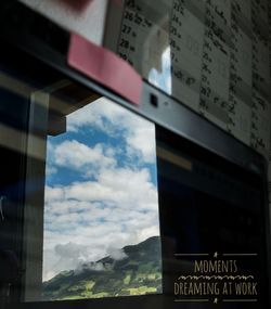 Low angle view of road sign against sky