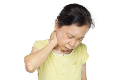 Mid adult woman against white background