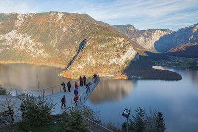 Hallstatt, austria tourists admiring the view at the panoramic viewing platform world heritage view