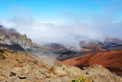 View of volcanic landscape against sky