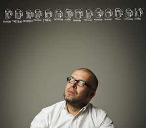 Portrait of man against black background