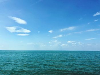 Scenic view of sea against blue sky