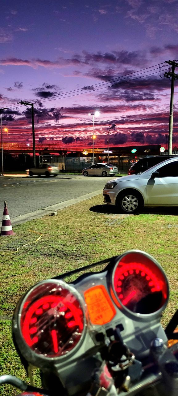 mode of transportation, transportation, car, motor vehicle, vehicle, sky, land vehicle, nature, grass, cloud, night, red, outdoors, plant