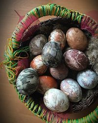 High angle view of eggs in basket on table