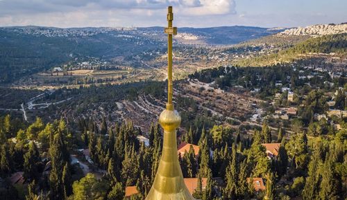View of religious cross against scenery