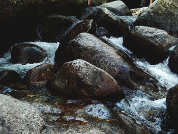 Close-up of stones in water