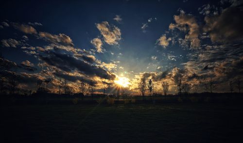 Scenic view of field against sky during sunset