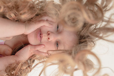 Close-up of girl with tousled hair