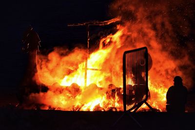 Bonfire against fire crackers at night