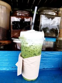 Close-up of drink in glass jar on table