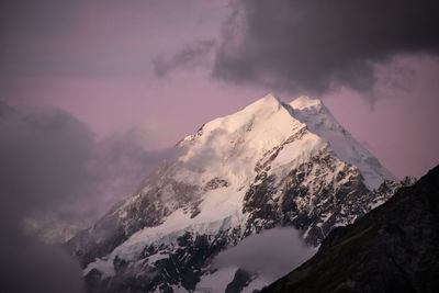 Scenic view of snowcapped mountains against sky during sunset