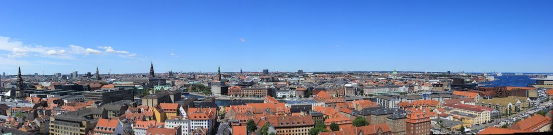 High angle view of townscape against blue sky