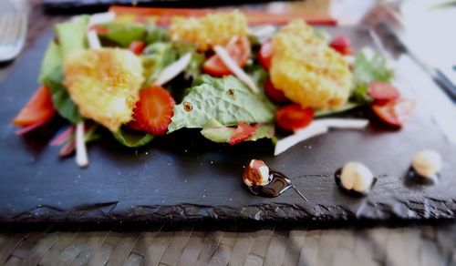 High angle view of salad on slate on table