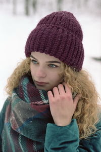 Portrait of young woman wearing hat