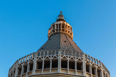 Low angle view of historical building against clear blue sky