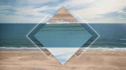 Digital composite image of beach against sky