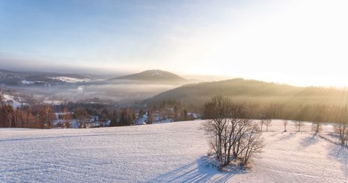 Scenic view of mountains against sky during winter