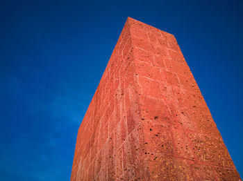 Low angle view of building against blue sky