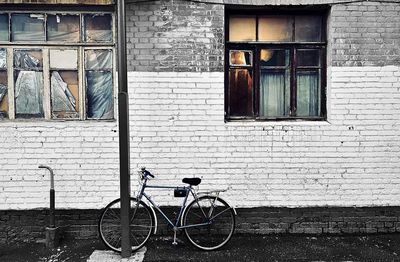 Bicycle against wall of building