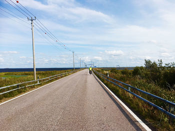 Empty road against sky